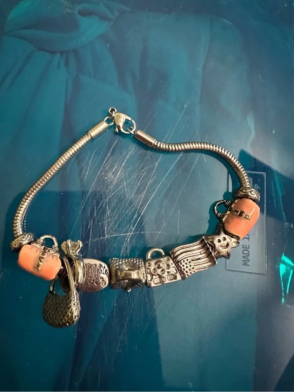 Silver Charm Bracelet with Coral Beads